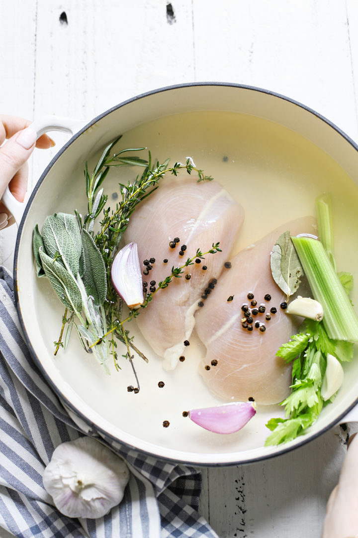 photo of poaching chicken breasts in a pot