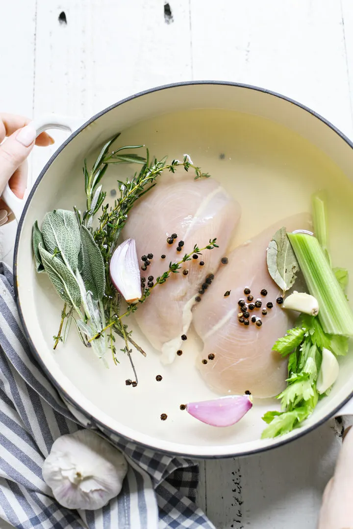 photo of poaching chicken breasts in a pot