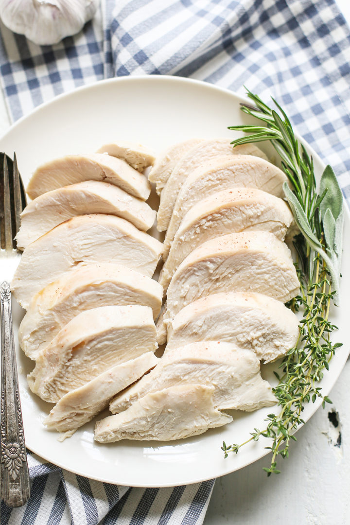 poached chicken breasts on a white plate
