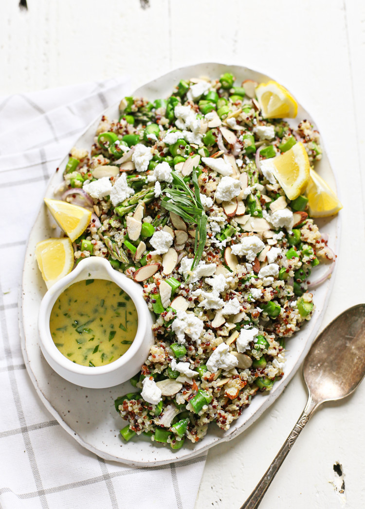 cold asparagus salad with goat cheese on a white platter