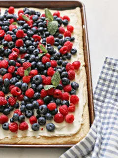 a red white and blue 4th of july dessert with fresh berries on a baking sheet