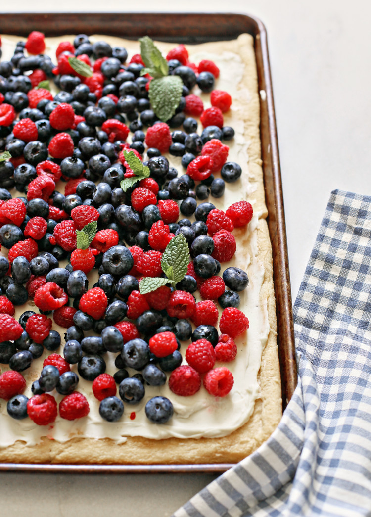 a red white and blue 4th of july dessert with fresh berries on a baking sheet