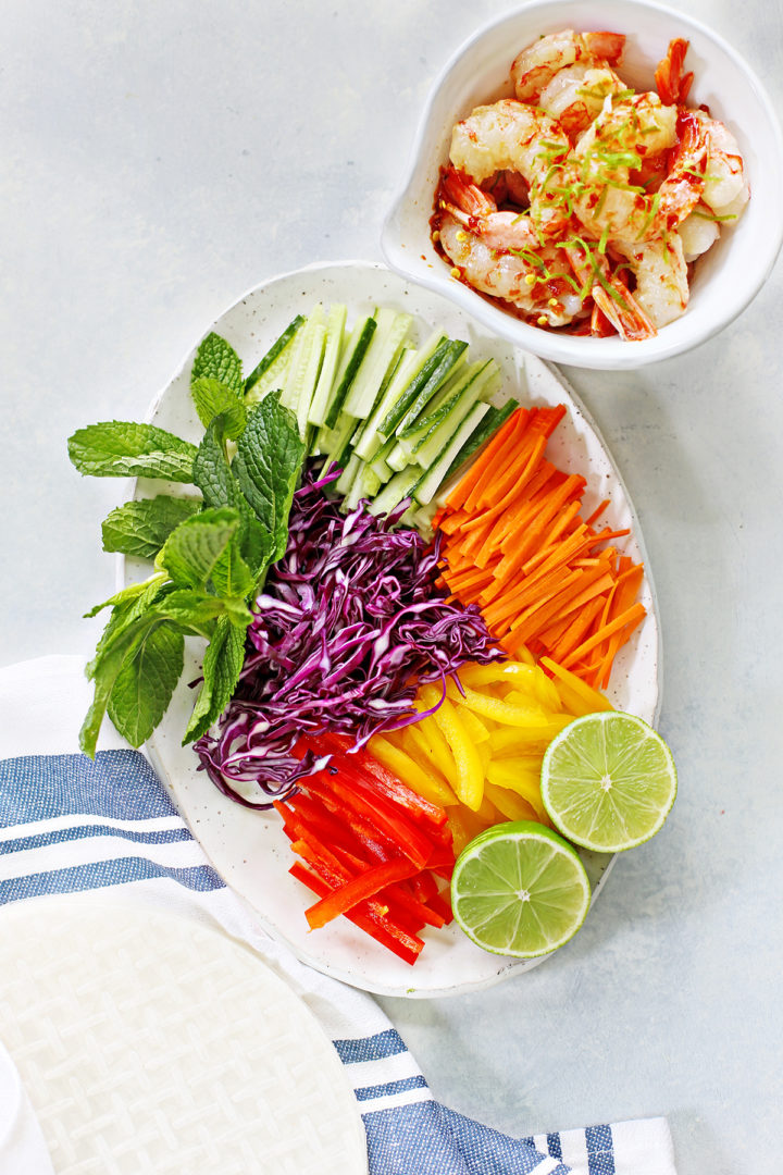 ingredients needed to make Vietnamese Spring Rolls arranged on a light surface