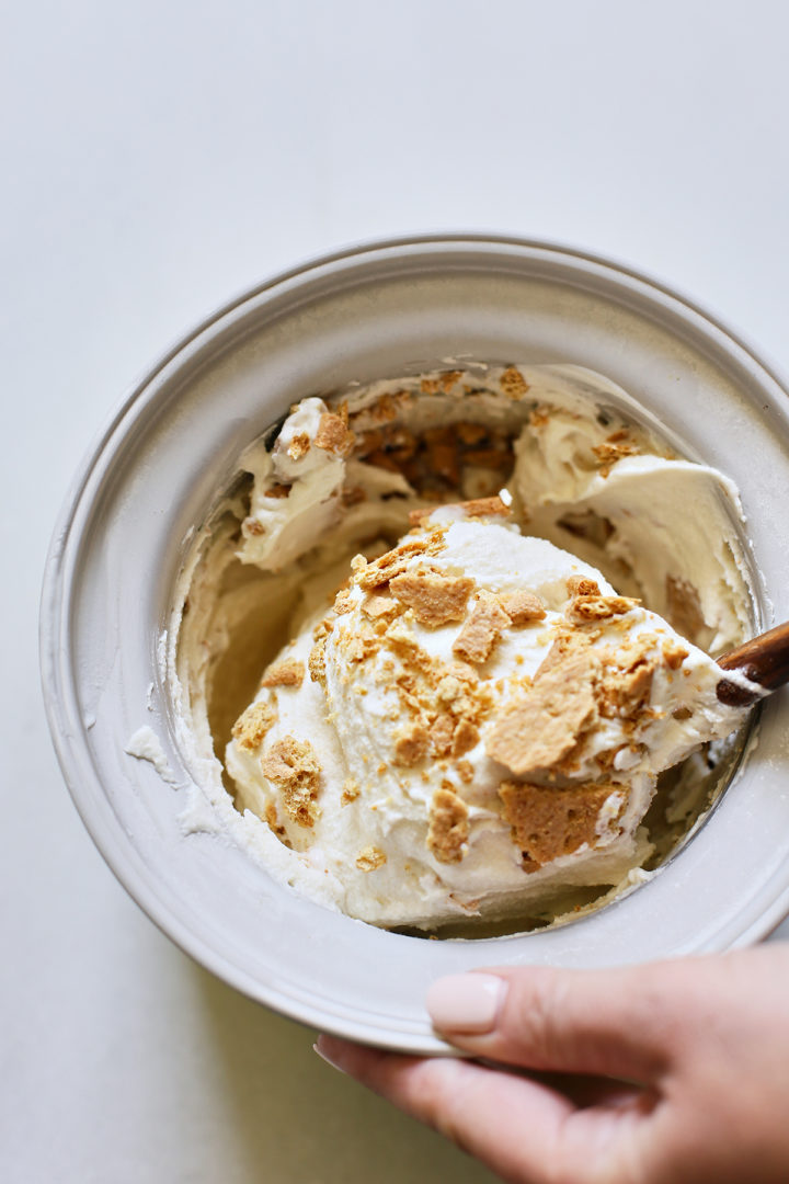 woman stirring graham cracker into key lime ice cream