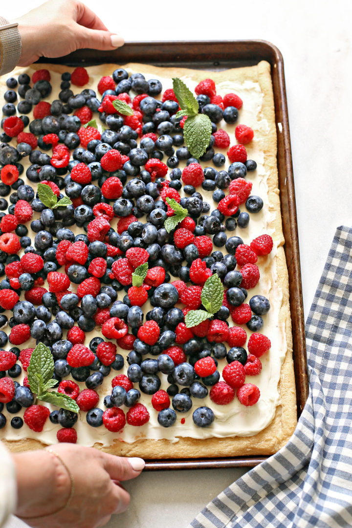 woman serving a berry dessert for 4th of july