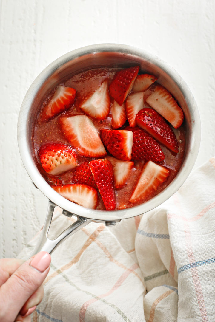 strawberry puree and fresh strawberries with other ingredients to make homemade strawberry topping