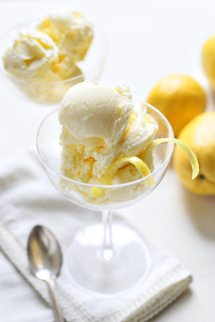 glass dessert dishes with scoops of lemon ice cream