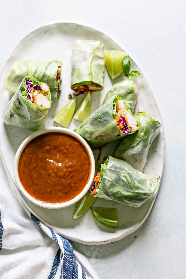Vietnamese Spring Rolls on a white serving tray with dipping sauce