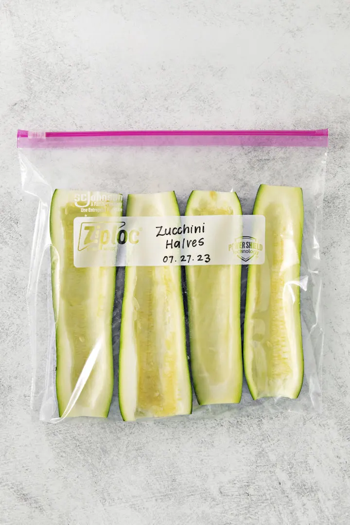 frozen zucchini halves in a freezer bag