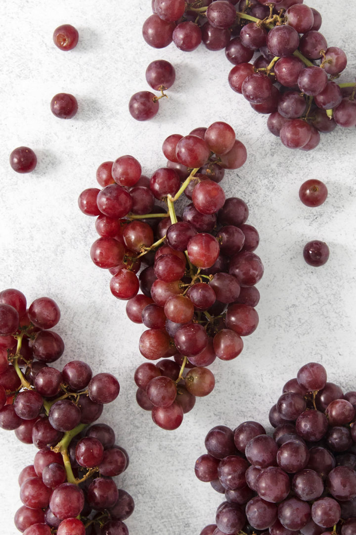 red grapes on a light surface 