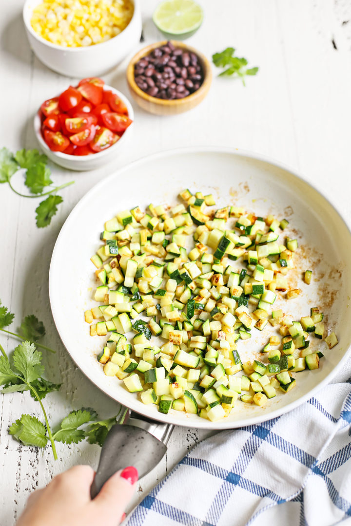 woman cooked fresh zucchini to make a recipe for zucchini salsa