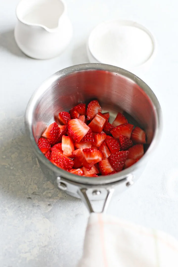chopped strawberries in a saucepan to make simple syrup