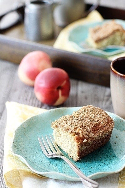 banana snack cake recipe on a blue plate with a fork