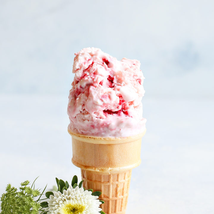 strawberry frozen yogurt on an ice cream cone