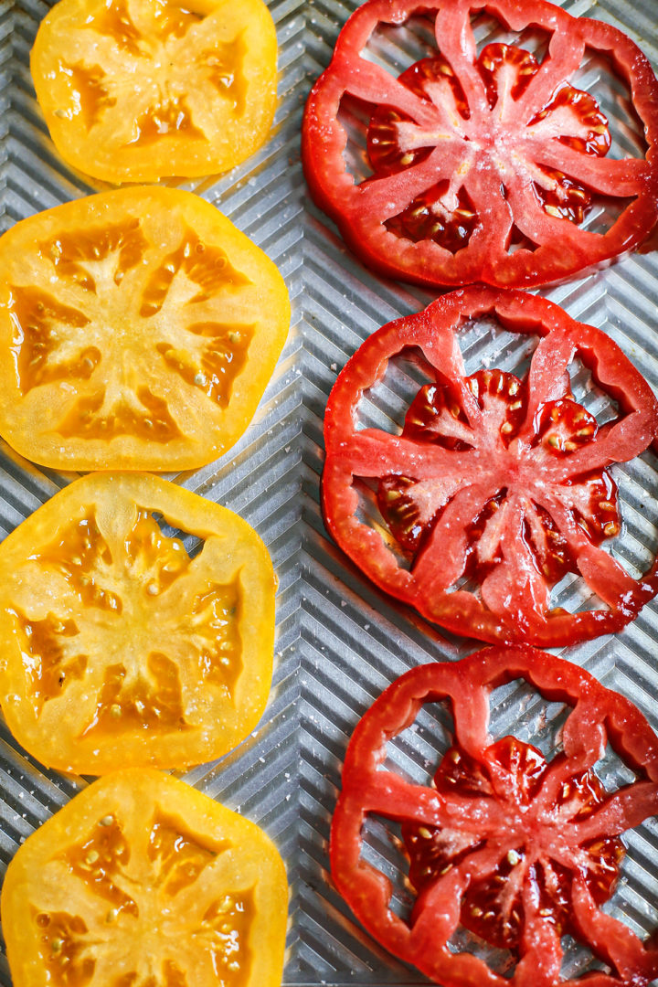 salting tomatoes to make caprese pizza