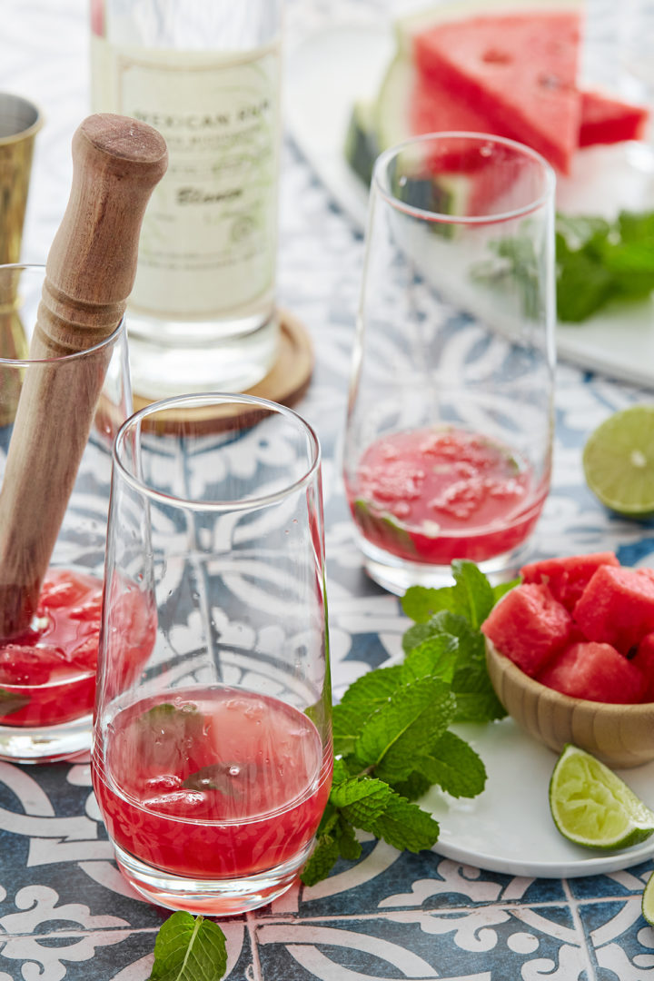 muddled watermelon with mint and simple syrup in a mojito glass
