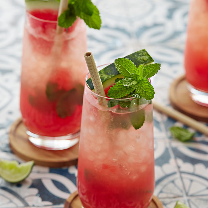 three watermelon mojitos on a blue tile counter