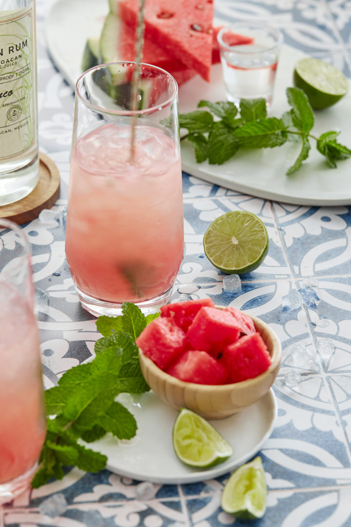 stirring a watermelon mojito cocktail