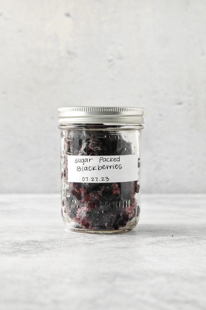 sugar packed frozen blackberries in a jar