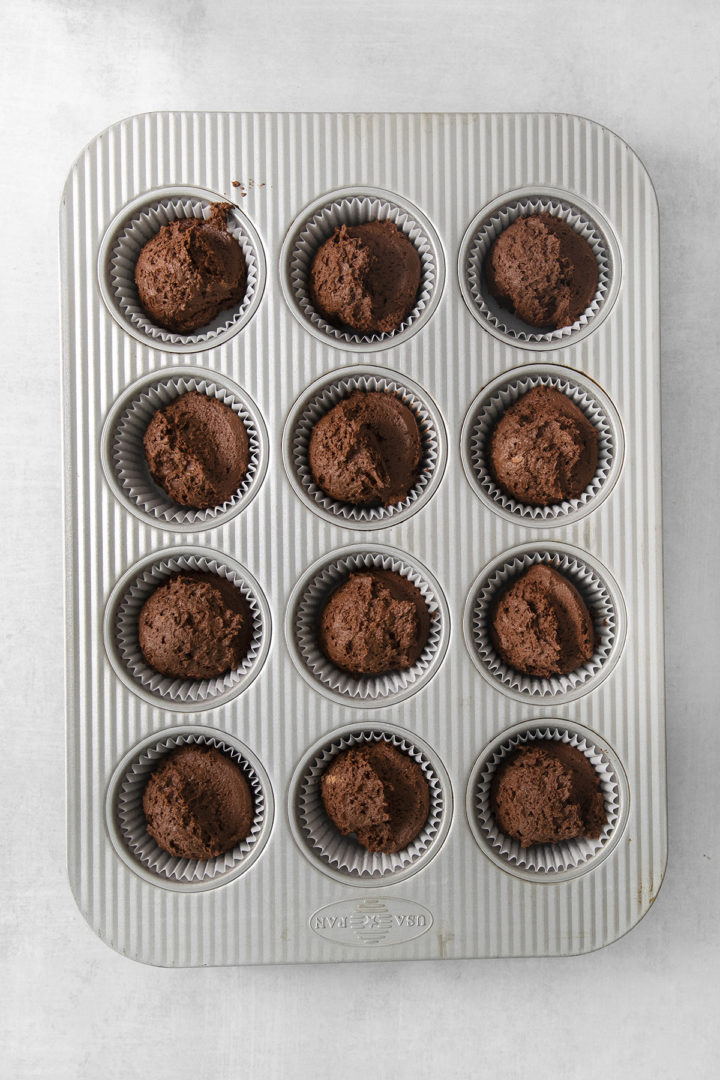 chocolate pumpkin cupcakes in a cupcake tin