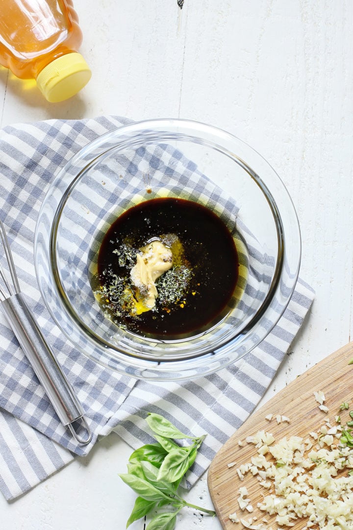 marinade for grilled bruschetta chicken in a glass bowl