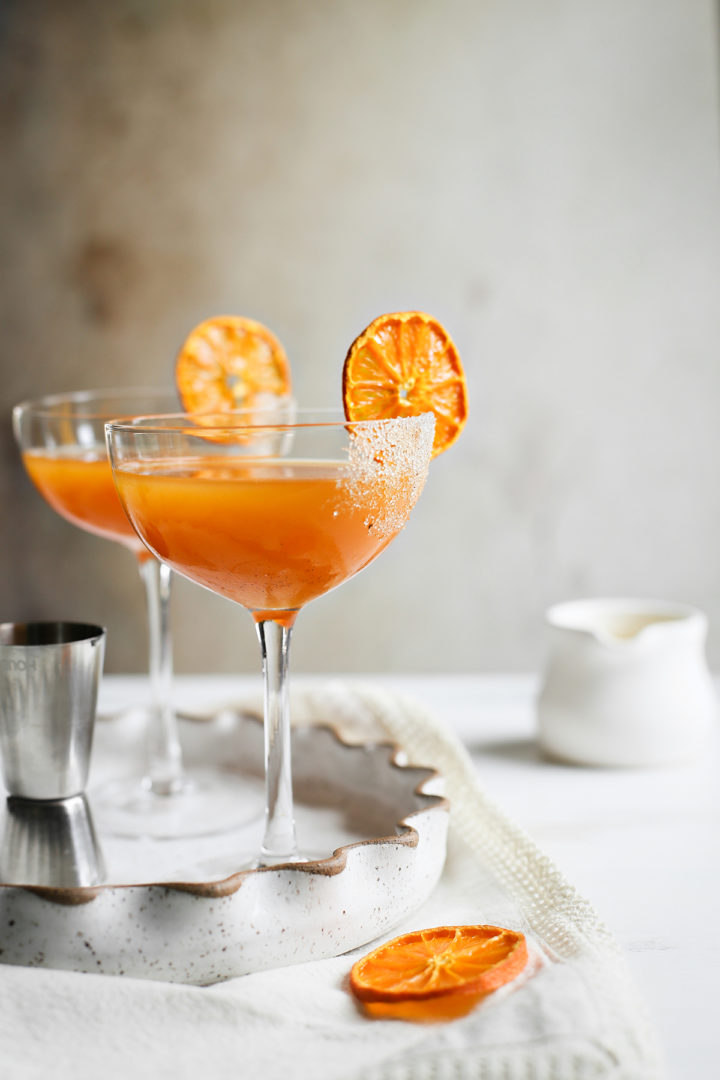 two coupe glasses filled with pumpkin martini