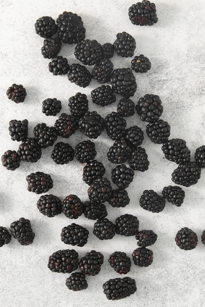 fresh blackberries being prepared for freezing