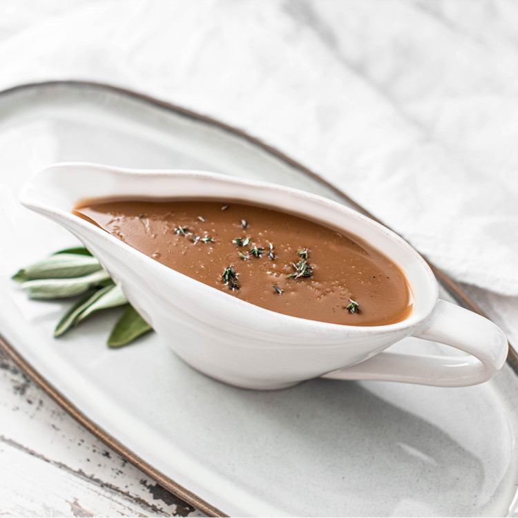 gravy boat full of turkey gravy made from drippings