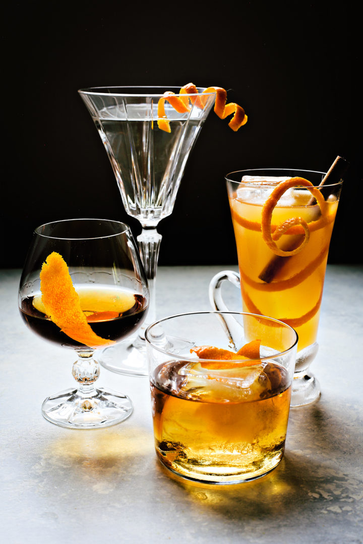 photo showing 4 types of orange twist garnishes for cocktails