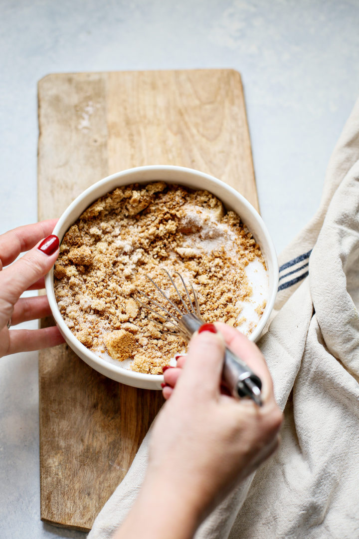 woman stirring sugar and spices for apple butter recipe