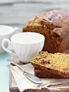 cranberry pumpkin bread on a cutting board