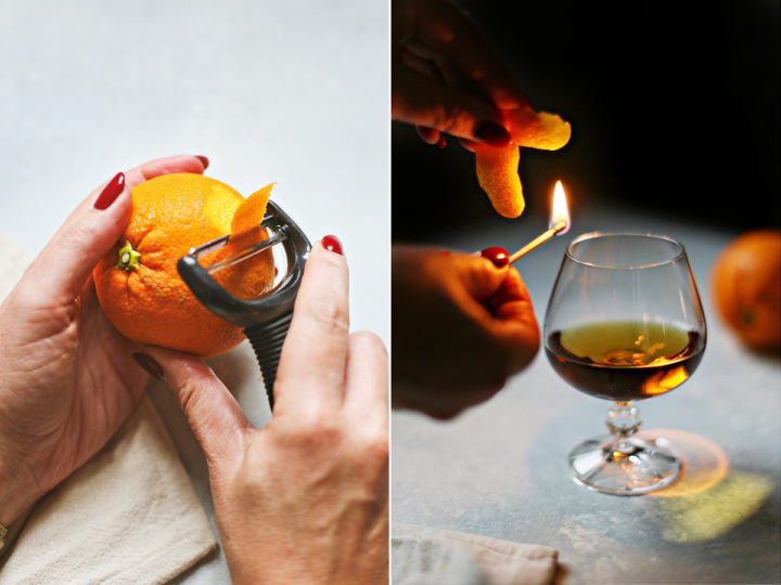 woman demonstrating how to make a flamed orange peel garnish