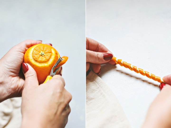 woman demonstrating how to make an orange peel spiral