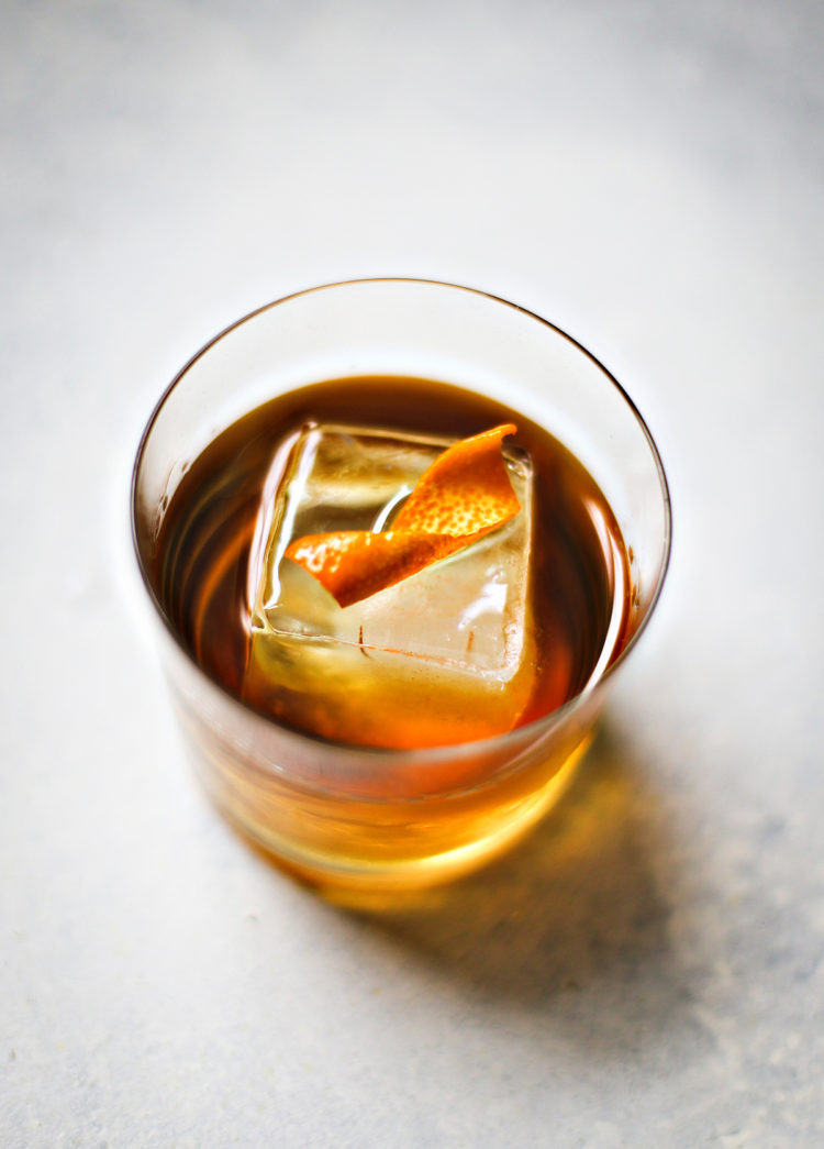 orange twist cocktail garnish in a cocktail