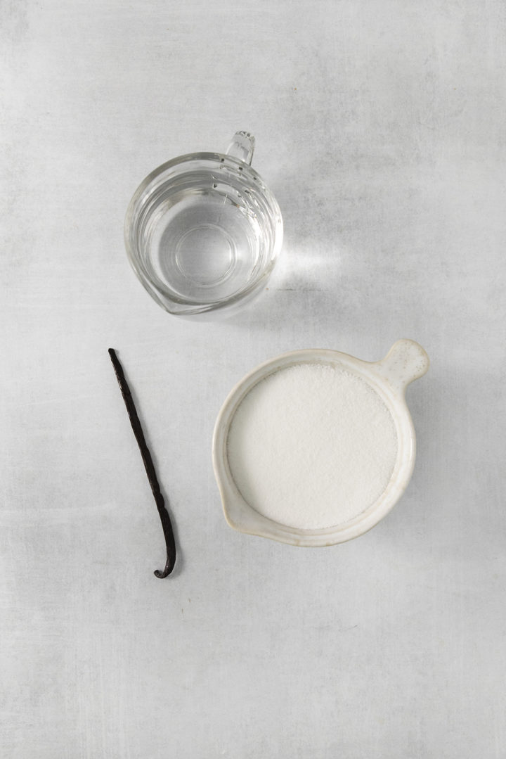 overhead photo of bowls containing ingredients to make vanilla syrup