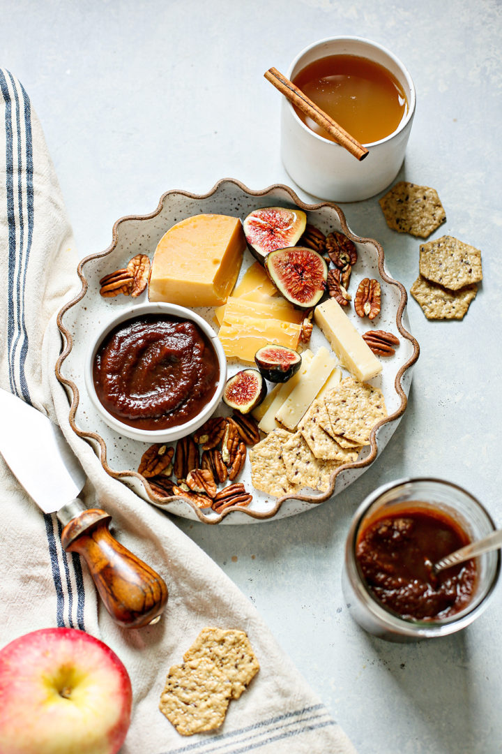 cheese and cracker plate with a bowl of instant pot apple butter