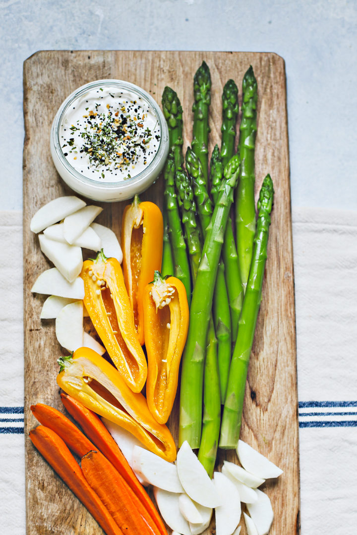 blanched asparagus on a wooden cutting board