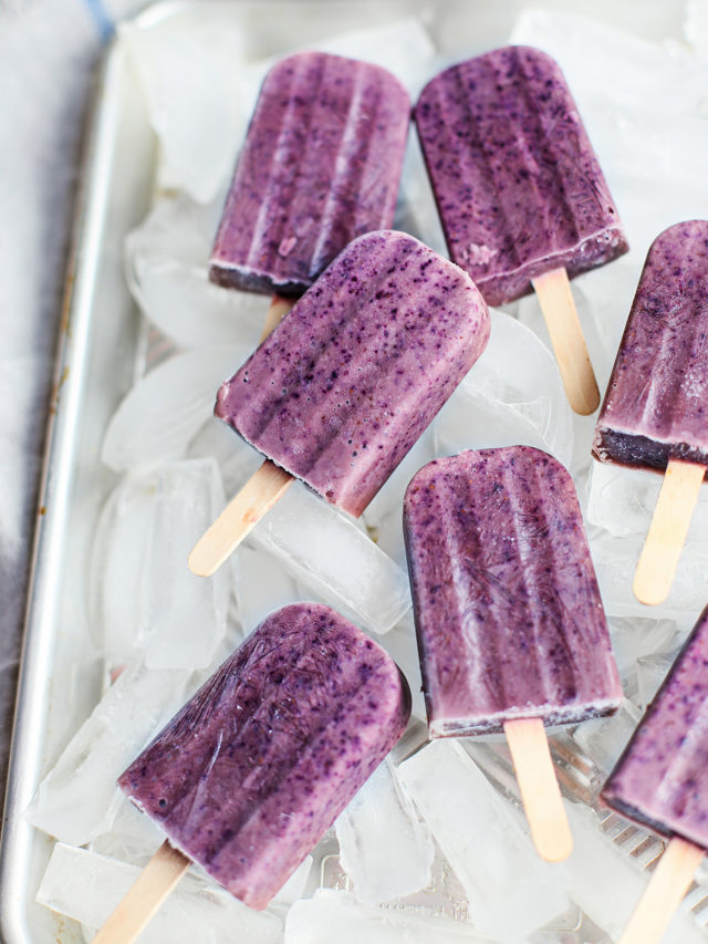 blueberry popsicles on a tray of ice