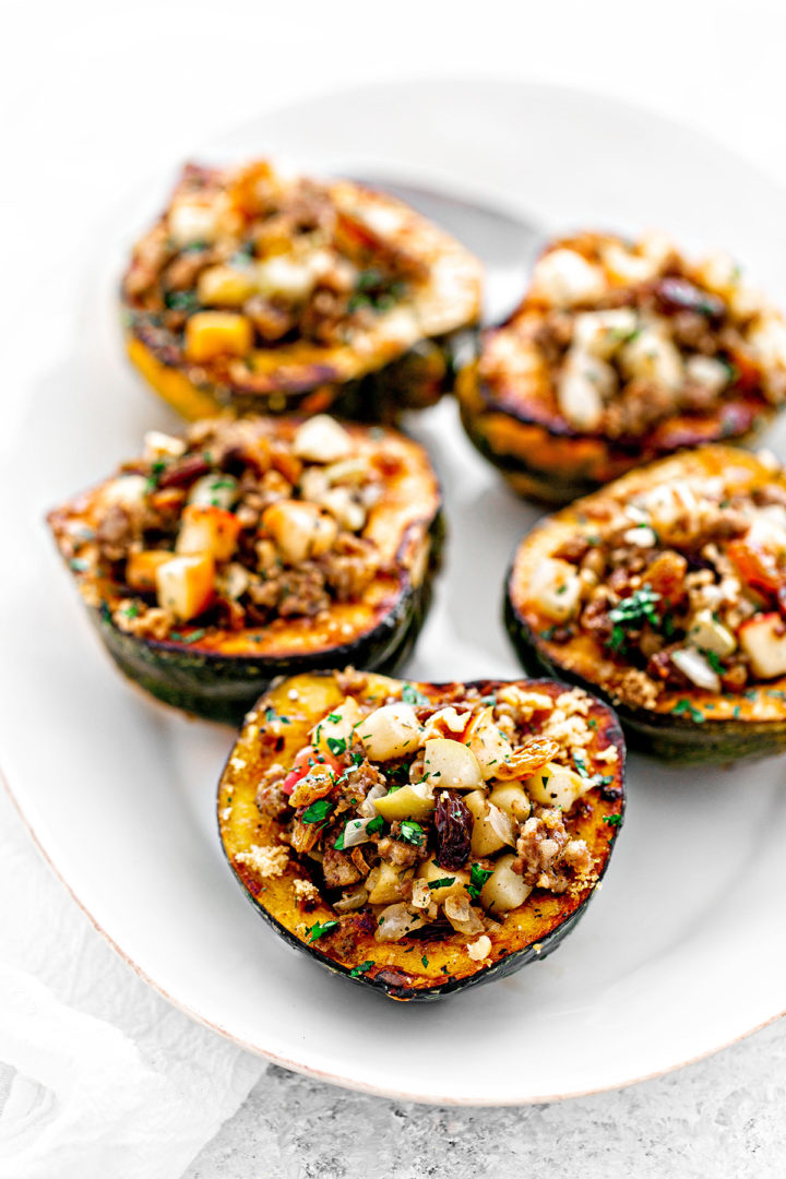 apple stuffed acorn squash on white plate