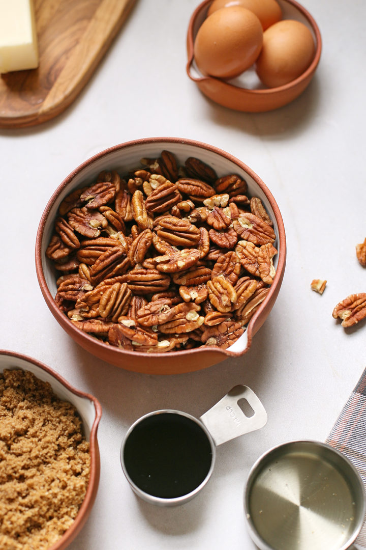 photo of ingredients to make pecan. bourbon pie in bowls on a counter