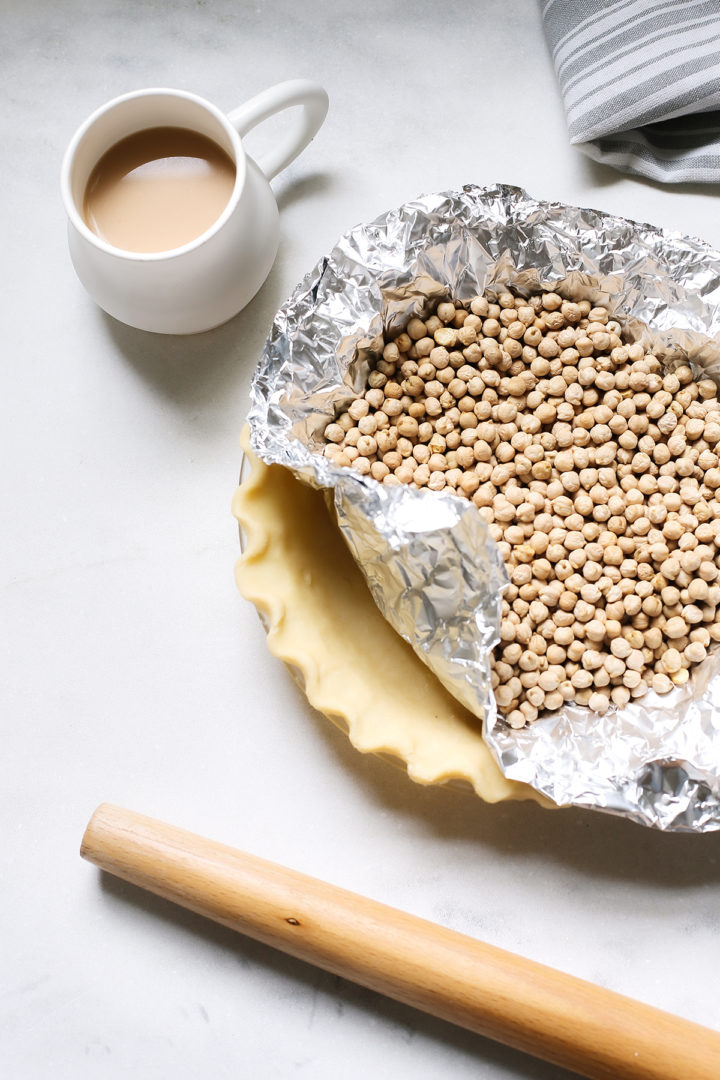 photo showing how to blind bake a pie crust for pecan pie with bourbon