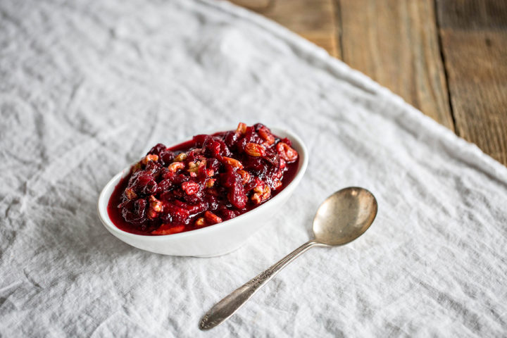 white serving dish filled with cranberry orange relish