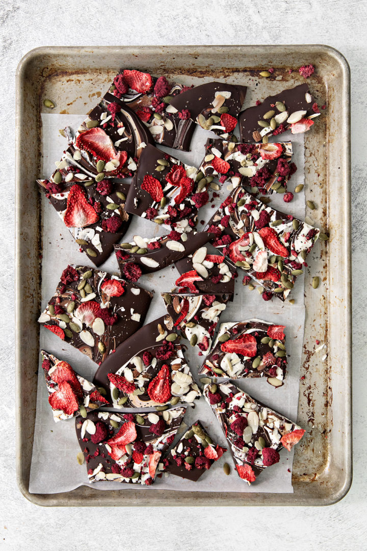 pieces of fruit and nut chocolate on a baking sheet
