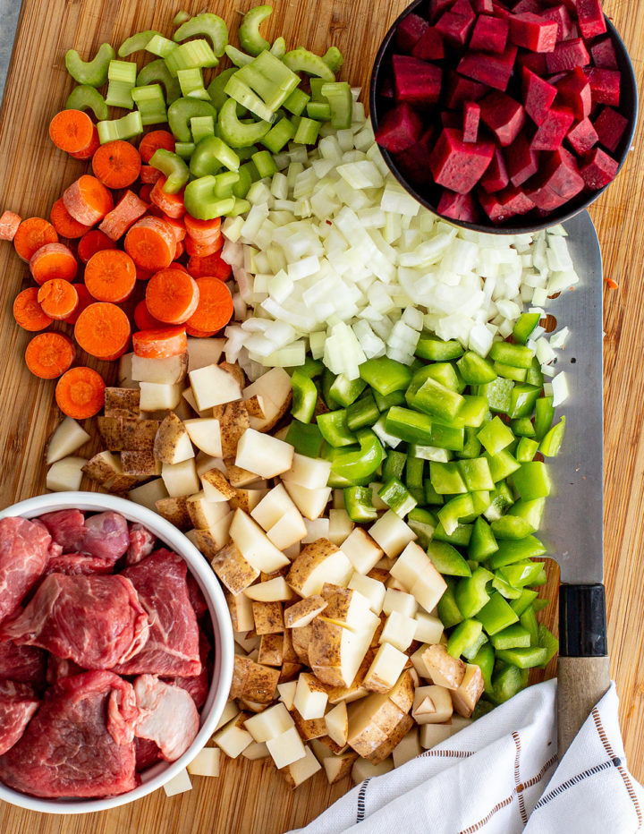overhead shot of ingredients to make a borscht recipe with meat