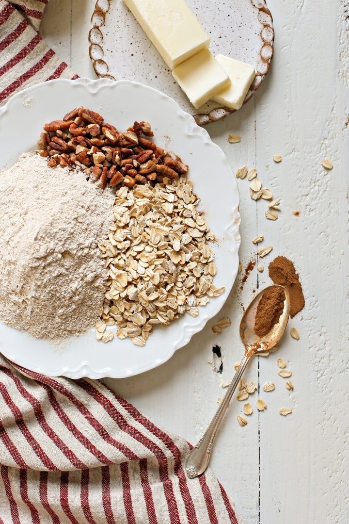 apple crisp with oatmeal topping ingredients on table 