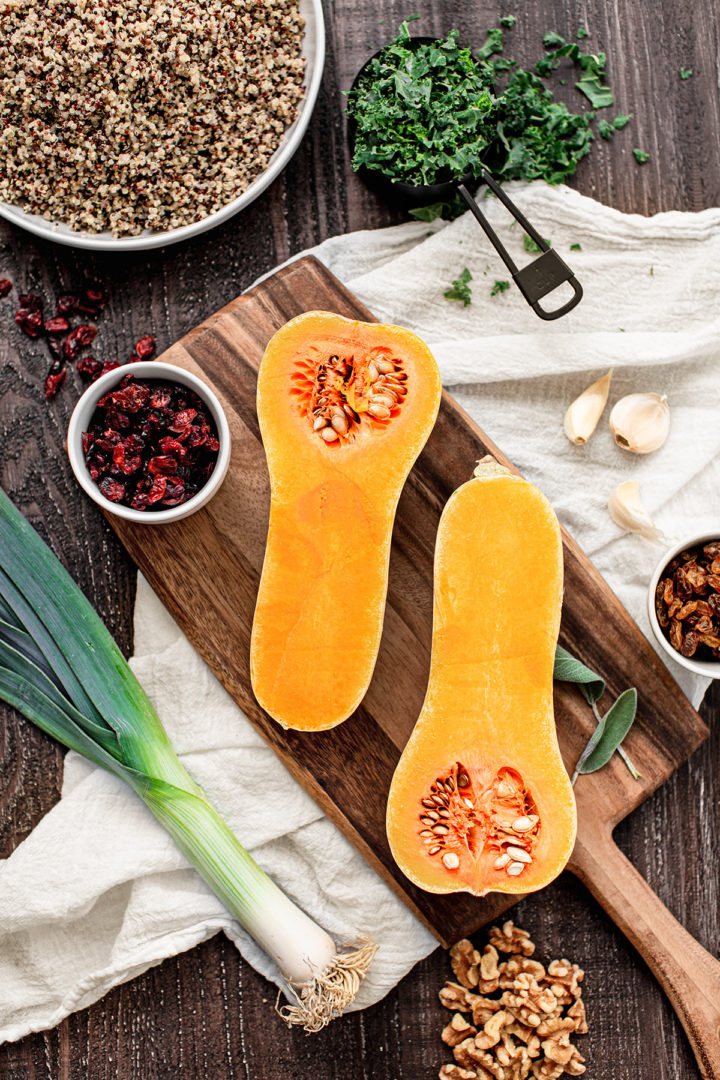 photo of ingredients (butternut squash, dried cranberries, leeks, walnuts, quinoa, garlic) to make this quinoa stuffing (recipe for butternut squash stuffing with quinoa)