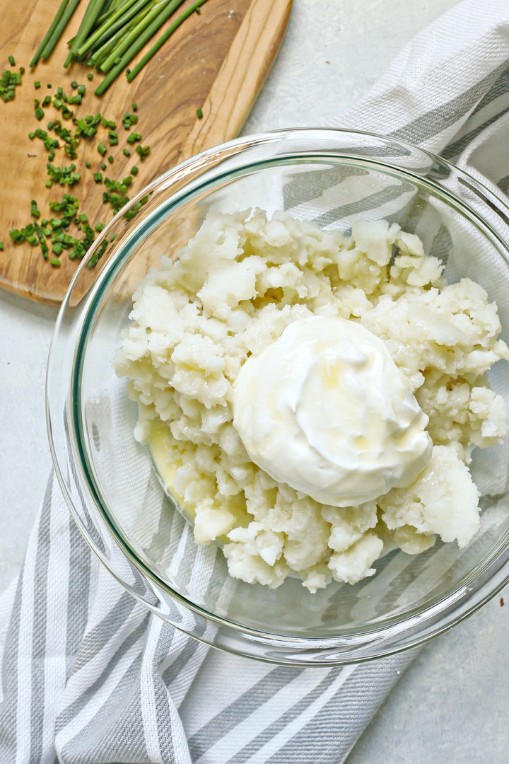 bowl of ingredients to make healthy greek yogurt mashed potatoes