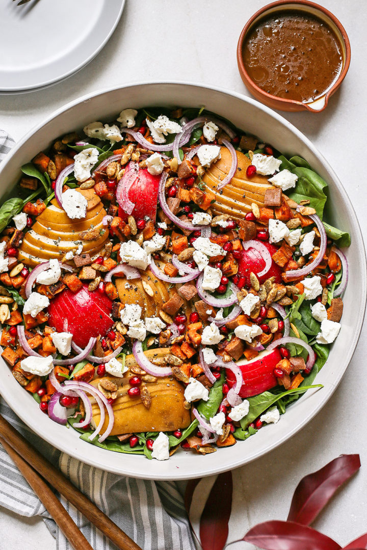 overhead photo of a thanksgiving salad recipe: spinach pear salad