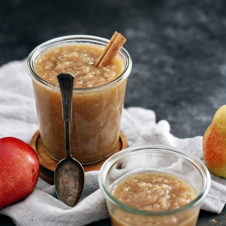 jars of pear sauce and a spoon