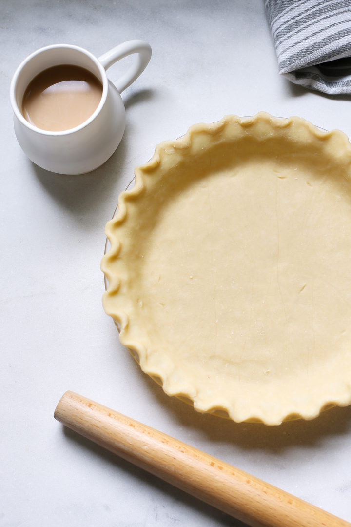 photo of a pie shell to be filled with bourbon pecan pie filling